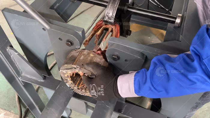 Workers Operating a Stator Coil Removal Machine